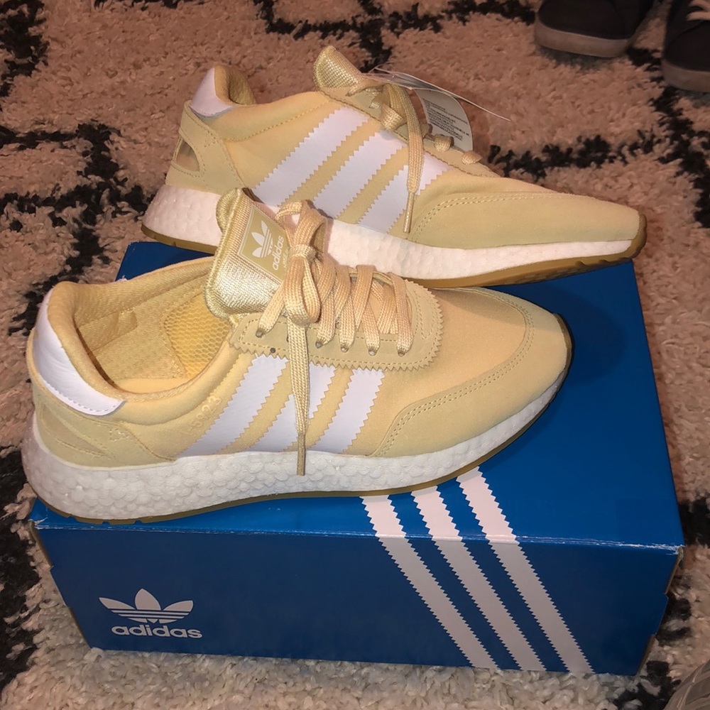 Pastel yellow adidas shoes
